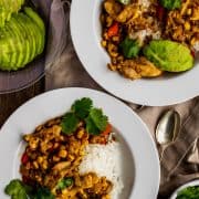 two bowls of salsa verde with avocado and cilantro