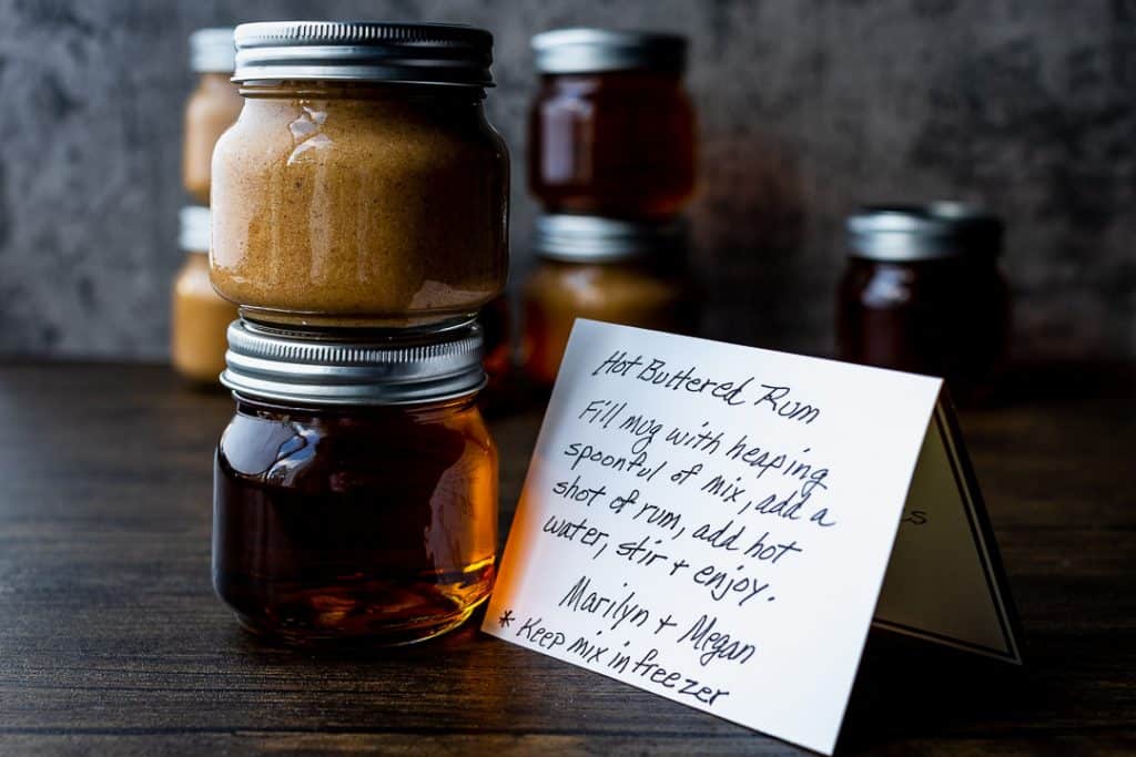 rum and hot buttered rum batter in mason jars with a handwritten instruction card