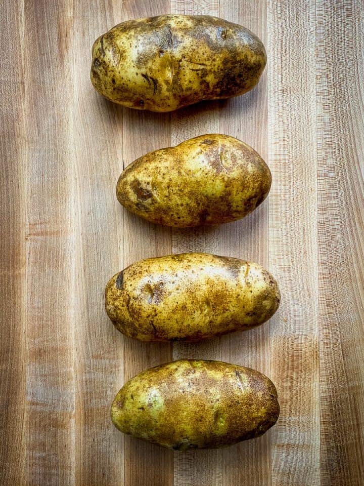 prepped potatoes sliced with a cross